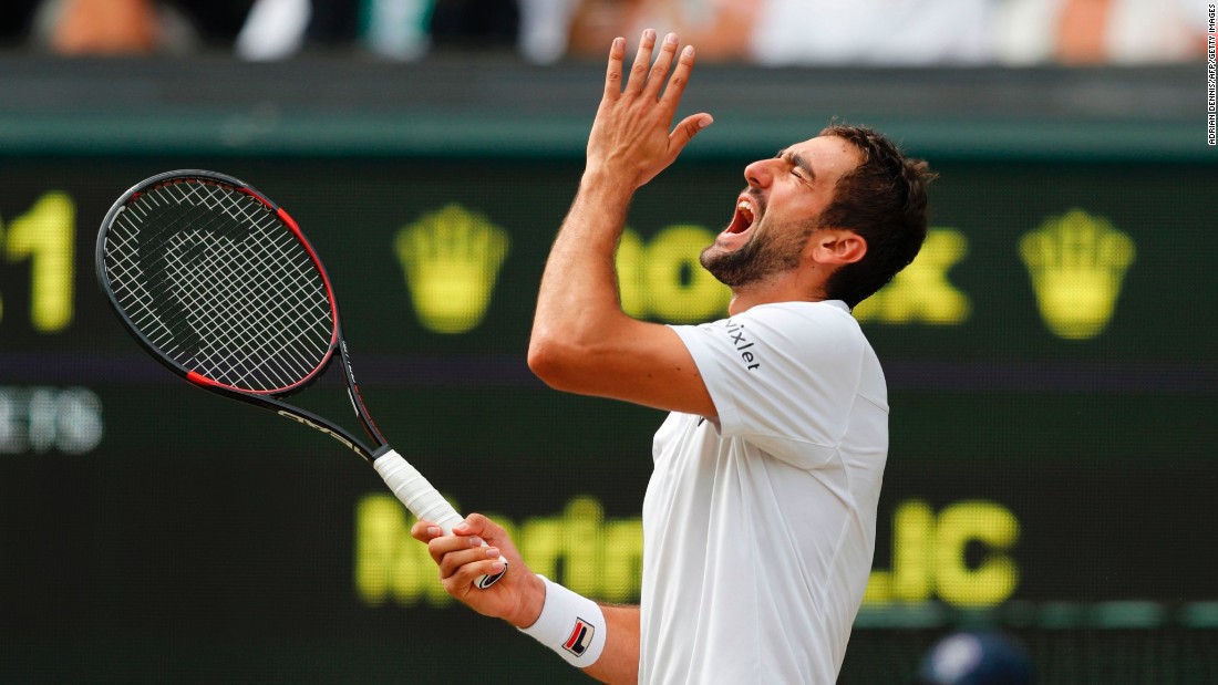 Cilic reacts after hitting the ball into the net.