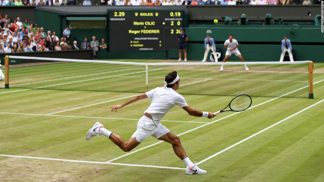 Federer hits a return.