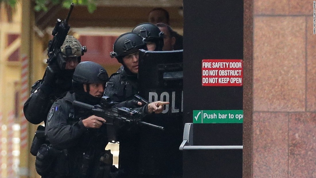 Armed police are seen outside the Lindt Cafe, Martin Place on December 15, 2014 in Sydney, Australia.