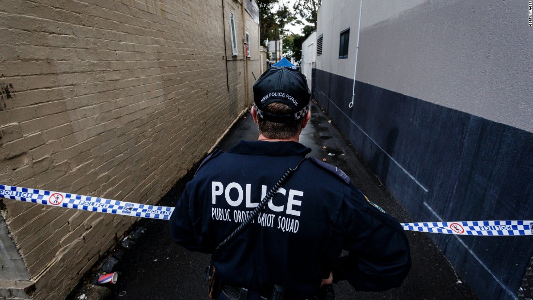 A Police officer watches over an ongoing operation in Surry Hills on July 31, 2017 in Sydney, Australia.