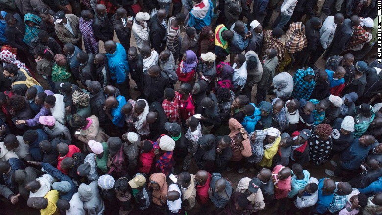 Voters line up at a station in Kibera. 