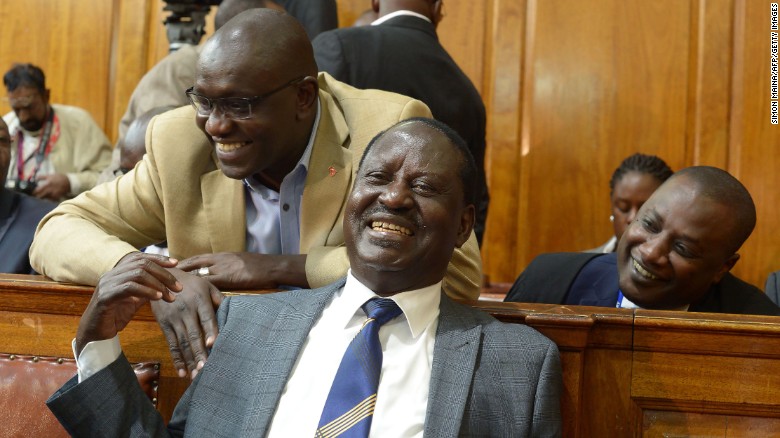 Kenya&#39;s opposition presidential candidate Raila Odinga (C) reacts to the Supreme Court ruling in Nairobi on Friday.