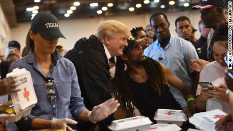 President Donald Trump and First Lady Melania Trump serve food to Hurricane Harvey victims at NRG Center in Houston on September 2.