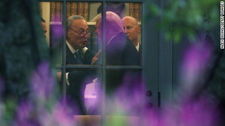 WASHINGTON, DC - SEPTEMBER 06:  U.S. Senate Minority Leader Chuck Schumer (D-NY) (L) makes a point to President Donald Trump in the Oval Office prior to his departure from the White House September 6, 2017 in Washington, DC. President Trump is traveling to North Dakota for a tax reform event with workers from the energy sector.  (Alex Wong/Getty Images)