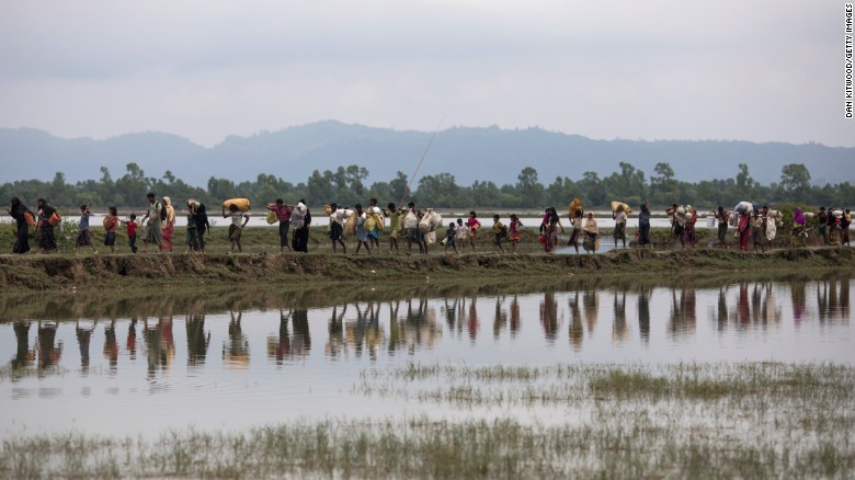 Rohingya Muslim refugees make their way into Bangladesh after crossing the border on September 07.