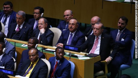 Turkey&#39;s President Recep Tayyip Erdogan (middle row R) and Deputy Prime Minister Recep Akdag (middle row 2 L) sit with other ministers during Trump&#39;s speech.