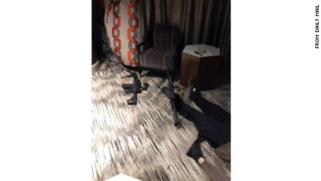 Leaked photos published by the Daily Mail show the scene, including what appears to be the the shooter's body, inside Stephen Paddock's room at the Mandalay Bay in Las Vegas. 