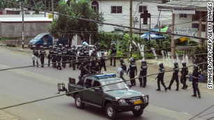 Cameroon police officials with riot equipment patrol in Buea, in Cameroon&#39;s Southwest Region, on October 1, 2017.
